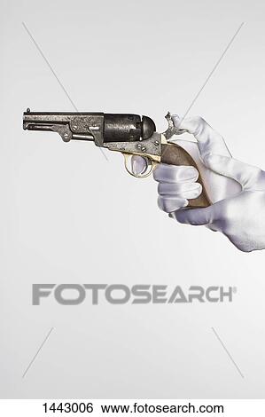 Cropped hands of bride holding handgun against white background View Large Photo Image Stock Photograph - Cropped hands of bride holding handgun against white background. Fotosearch