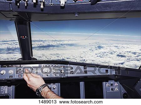 Cropped image of pilot in airplane cockpit View Large Photo Image Stock Image - Cropped image of pilot in airplane cockpit. Fotosearch