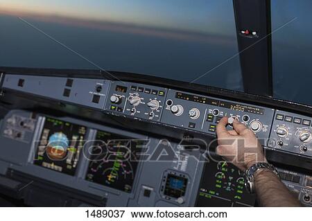Cropped image of pilot in airplane cockpit View Large Photo Image Stock Photo - Cropped image of pilot in airplane cockpit. Fotosearch