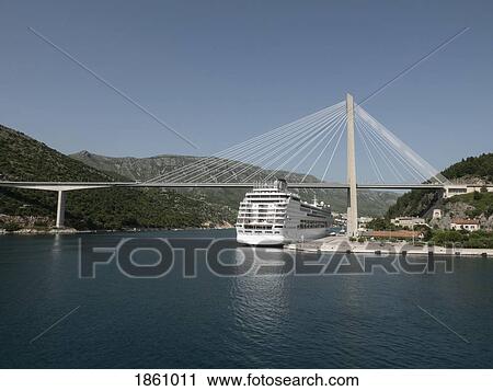 Cruise ship moored under sunny Franjo Tudjman bridge, Dubrovnik, Croatia View Large Photo Image Stock Image - Cruise ship moored under sunny Franjo Tudjman bridge, Dubrovnik, Croatia. Fotosearch