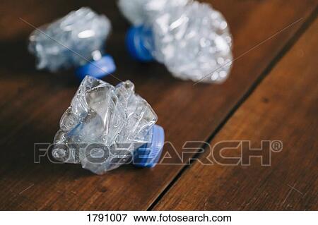 Crumpled, recycled plastic water bottles View Large Photo Image Stock Photo - Crumpled, recycled plastic water bottles. Fotosearch