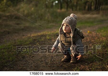 Cute girl playing with sticks View Large Photo Image Stock Photography - Cute girl playing with sticks. Fotosearch