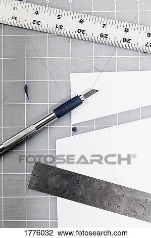 Cutter and rulers on cutting mat View Large Photo Image Stock Image - Cutter and rulers on cutting mat. Fotosearch