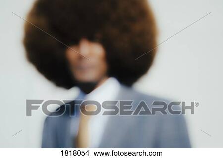 Picture - Defocused portrait well-dressed young man with afro. Fotosearch