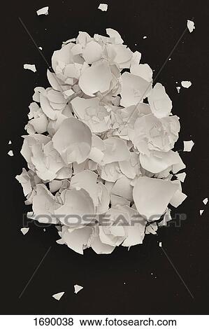 Directly above shot of broken eggshell on black background View Large Photo Image Stock Photo - Directly above shot of broken eggshell on black background. Fotosearch