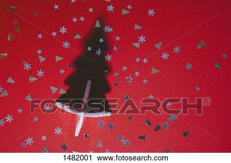 Directly above shot of Christmas tree and sequins on red table View Large Photo Image Stock Image - Directly above shot of Christmas tree and sequins on red table. Fotosearch