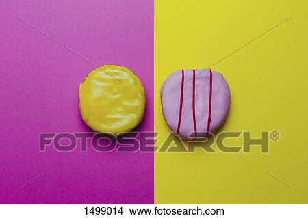 Directly above shot of donuts on colored background View Large Photo Image Picture - Directly above shot of donuts on colored background. Fotosearch
