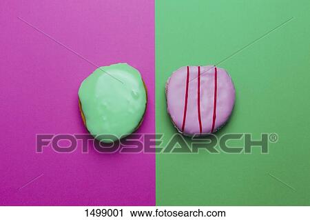 Directly above shot of donuts on colored background View Large Photo Image Stock Image - Directly above shot of donuts on colored background. Fotosearch