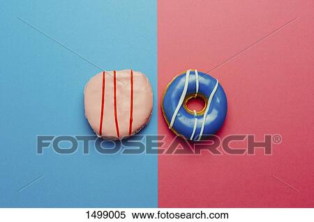 Directly above shot of donuts on colored background View Large Photo Image Stock Photography - Directly above shot of donuts on colored background. Fotosearch