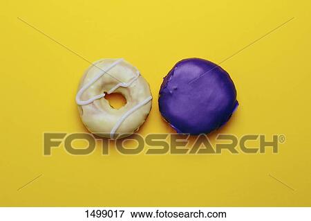 Directly above shot of donuts on yellow background View Large Photo Image Stock Photo - Directly above shot of donuts on yellow background. Fotosearch