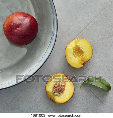 Directly above shot of peaches on table and container View Large Photo Image Stock Image - Directly above shot of peaches on table and container. Fotosearch