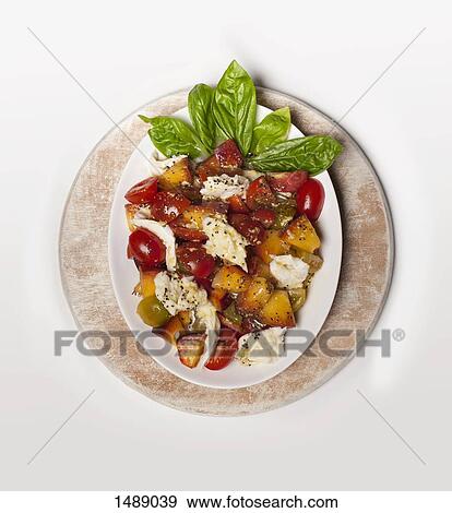 Directly above shot of salad served in plate over white background View Large Photo Image Stock Photo - Directly above shot of salad served in plate over white background. Fotosearch