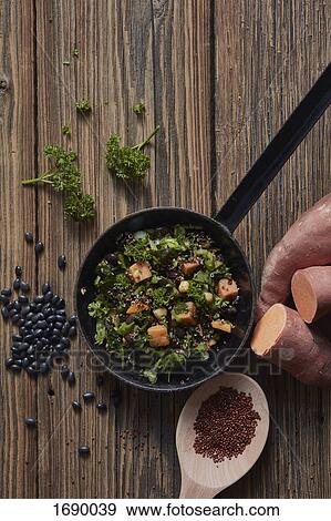 Directly above shot of sweet potato salad in cooking pan on wooden table View Large Photo Image Stock Photo - Directly above shot of sweet potato salad in cooking pan on wooden table. Fotosearch