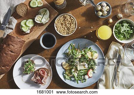 Stock Image - Directly above shot of various food on table. Fotosearch