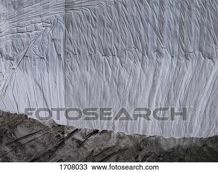 Directly above view of tarpaulin covering rock formation, Gletsch Wallis, Switzerland View Large Photo Image Stock Image - Directly above view of tarpaulin covering rock formation, Gletsch Wallis, Switzerland. Fotosearch