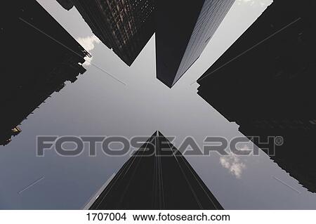 Directly below view of skyscrapers against sky, New York City, New York, USA View Large Photo Image Picture - Directly below view of skyscrapers against sky, New York City, New York, USA. Fotosearch