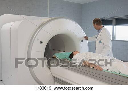 Doctor preparing patient for MRI in hospital View Large Photo Image Stock Image - Doctor preparing patient for MRI in hospital. Fotosearch