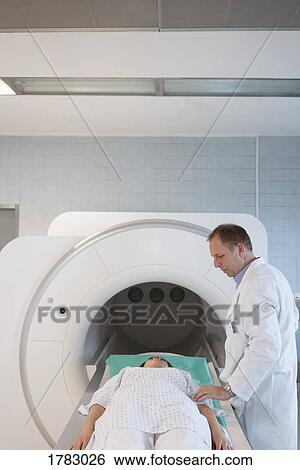 Doctor talking with patient preparing for MRI in hospital View Large Photo Image Stock Photograph - Doctor talking with patient preparing for MRI in hospital. Fotosearch