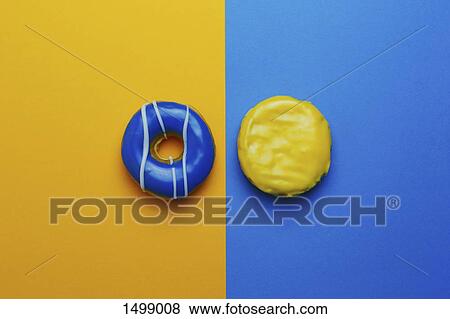 Donuts on colored background View Large Photo Image Stock Photo - Donuts on colored background. Fotosearch