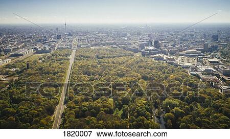 Drone point of view sunny Tiergarten Park and Berlin cityscape, Germany View Large Photo Image Stock Photo - Drone point of view sunny Tiergarten Park and Berlin cityscape, Germany. Fotosearch