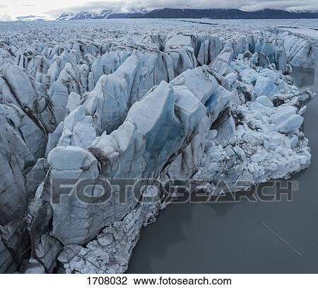 Drone view of glacier in lagoon, Knik Glacier, Palmer, Alaska, USA View Large Photo Image Stock Image - Drone view of glacier in lagoon, Knik Glacier, Palmer, Alaska, USA. Fotosearch