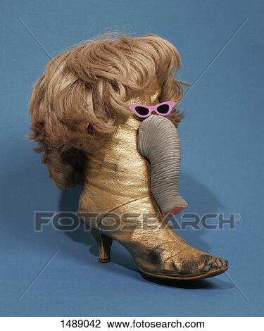 Elephant made from boot and wig over blue background View Large Photo Image Stock Image - Elephant made from boot and wig over blue background. Fotosearch
