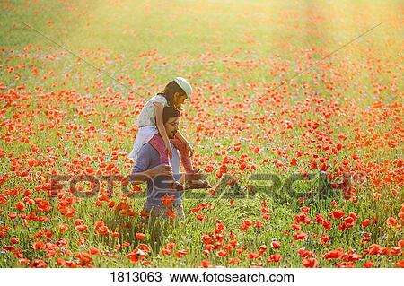 Father carrying daughter on shoulders in sunny idyllic rural field with red poppies View Large Photo Image Stock Image - Father carrying daughter on shoulders in sunny idyllic rural field with red poppies. Fotosearch