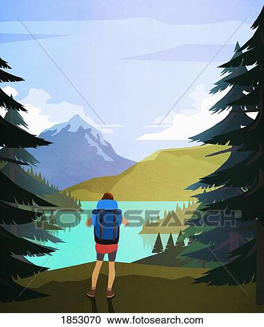 Stock Image - Female hiker enjoying scenic lake and mountain view. Fotosearch