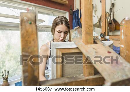 Female painter working in studio View Large Photo Image Stock Photo - Female painter working in studio. Fotosearch