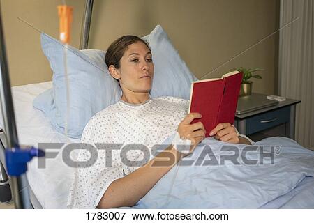 Female patient reading book, resting and recovering in hospital room View Large Photo Image Stock Photo - Female patient reading book, resting and recovering in hospital room. Fotosearch