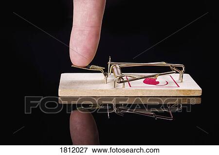 Finger pressing mousetrap View Large Photo Image Stock Photo - Finger pressing mousetrap. Fotosearch