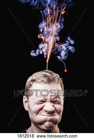Fireworks emitting over mans head View Large Photo Image Stock Photo - Fireworks emitting over mans head. Fotosearch
