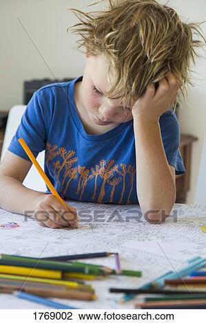 Focused boy coloring View Large Photo Image Stock Image - Focused boy coloring. Fotosearch