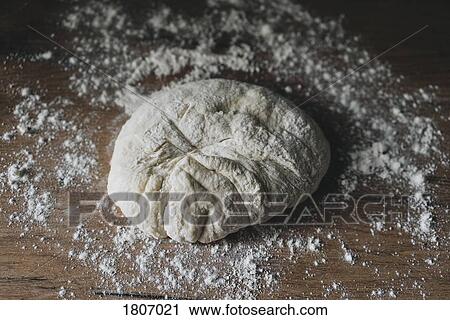 Fresh bread dough on floured wooden surface View Large Photo Image Stock Image - Fresh bread dough on floured wooden surface. Fotosearch