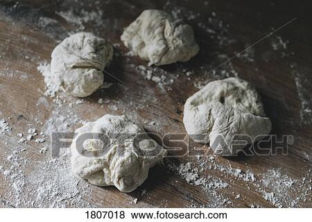 Fresh bread dough on floured wooden counter View Large Photo Image Stock Photo - Fresh bread dough on floured wooden counter. Fotosearch
