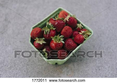 Stock Image - Fresh, ripe red strawberries. Fotosearch