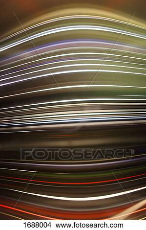 Picture - Full frame abstract image of colorful light trails. Fotosearch