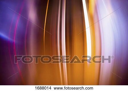 Full frame abstract image of orange light trails View Large Photo Image Picture - Full frame abstract image of orange light trails. Fotosearch