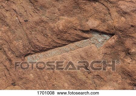 Full frame shot of arrow symbol on brown rock View Large Photo Image Stock Photo - Full frame shot of arrow symbol on brown rock. Fotosearch