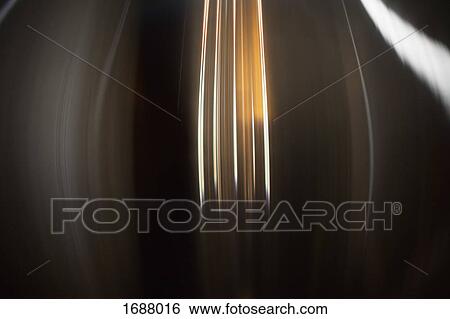 Stock Photograph - Full frame shot of glowing abstract light trails. Fotosearch