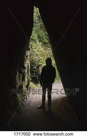 Full length of silhouette man standing in cave, Elbe Sandstone Mountains, Germany View Large Photo Image Stock Image - Full length of silhouette man standing in cave, Elbe Sandstone Mountains, Germany. Fotosearch