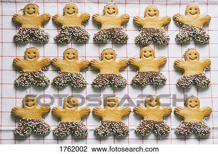 Gingerbread men Christmas cookies arranged in rows View Large Photo Image Stock Image - Gingerbread men Christmas cookies arranged in rows. Fotosearch