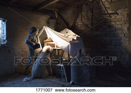 Girl and dog with flashlight peeking under cloth in carpentry workshop View Large Photo Image Stock Photo - Girl and dog with flashlight peeking under cloth in carpentry workshop. Fotosearch