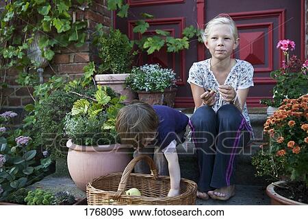 Girls sitting among flowerpots on front stoop View Large Photo Image Stock Photography - Girls sitting among flowerpots on front stoop. Fotosearch