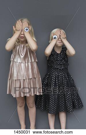 Girls with eye tattoo on hands against gray background View Large Photo Image Stock Image - Girls with eye tattoo on hands against gray background. Fotosearch