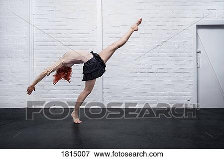 Graceful modern female dancer performing View Large Photo Image Stock Photo - Graceful modern female dancer performing. Fotosearch