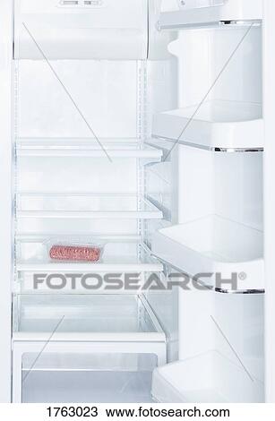 Ground beef in open, empty white refrigerator View Large Photo Image Stock Image - Ground beef in open, empty white refrigerator. Fotosearch