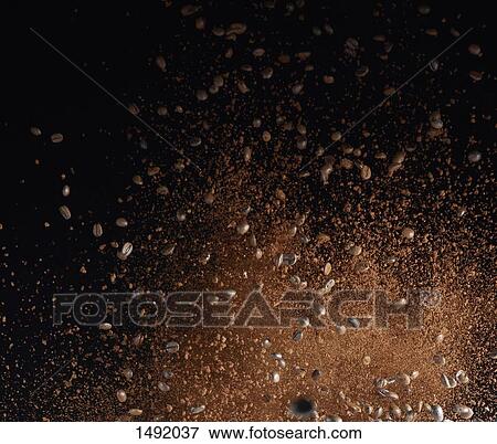 Ground coffee beans in mid-air against black background View Large Photo Image Stock Photo - Ground coffee beans in mid-air against black background. Fotosearch