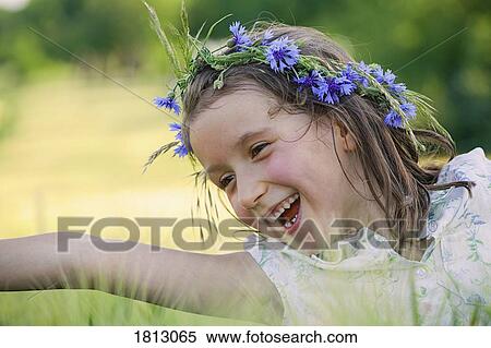 Happy, carefree girl with flowers in hair View Large Photo Image Stock Photography - Happy, carefree girl with flowers in hair. Fotosearch