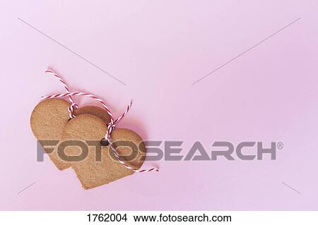 Heart shaped gingerbread Christmas cookie decorations View Large Photo Image Picture - Heart shaped gingerbread Christmas cookie decorations. Fotosearch